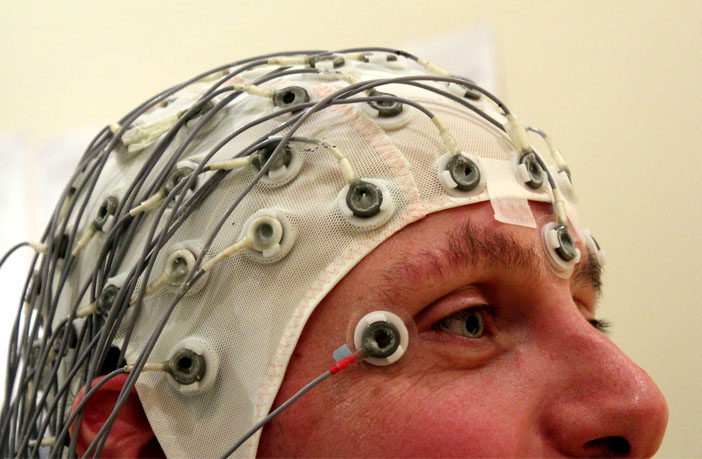 Man wearing an EEG cap (Photo credit: Chris Hope)