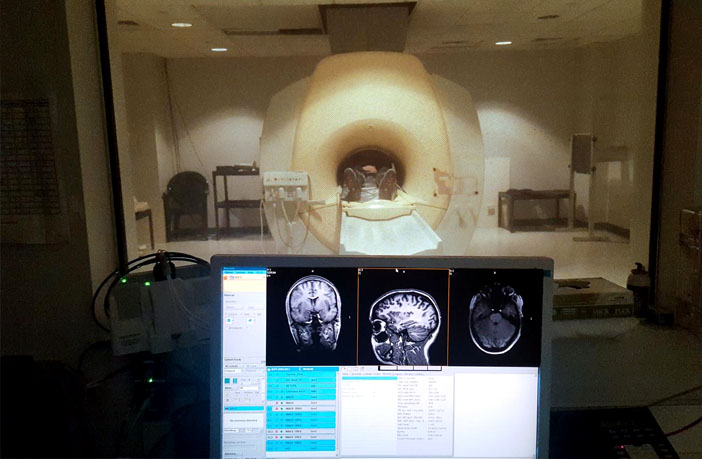 This is a photo of a participant in a Magnetic Resonance Imaging (MRI) scanner. (Photo credit: Boston University Medical School Center for Biomedical Imaging)
