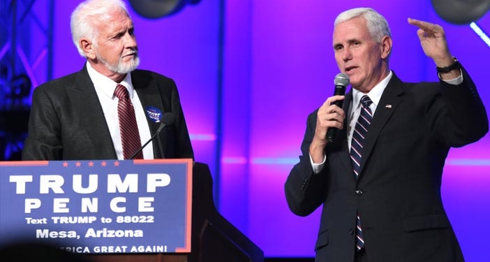 Pastor Tom Anderson and Governor Mike Pence speaking with supporters at a campaign rally and church service at the Living Word Bible Church in Mesa, Arizona. (Photo credit: Gage Skidmore)