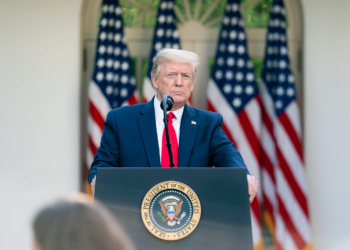 President Donald J. Trump listens to a reporter’s question during the coronavirus update briefing Monday, April 27, 2020, in the Rose Garden of the White House (Official White House Photo by Tia Dufour)
