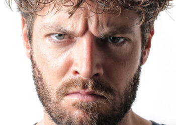 Narcissistic individuals exhibit amplified threat-related facial muscle activity in response to negative feedback